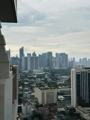 a view of a city skyline with tall buildings at Resort-style oasis at the the heart of the city in Manila