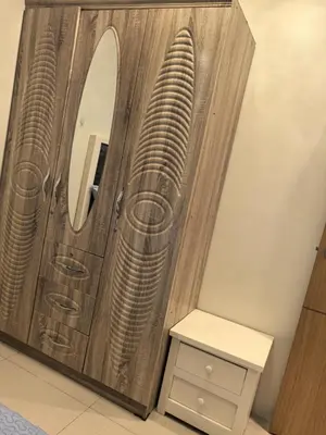 a bathroom with a wooden door with a mirror at 2 BEDROOM SHELL RESIDENCES MOA view in Manila