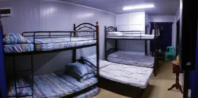 a room with three bunk beds in it at 6 Guest - Unit 6 Studio type - Container house in Pasong Mannga