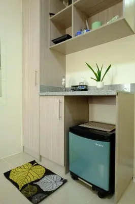 a kitchen with a counter with a dishwasher in it at Condotel in Manila