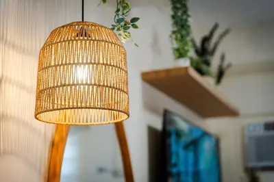 a wooden bird cage hanging from a wall at SSM Staycation in Manila
