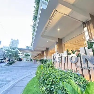 a building with a sign on the side of it at A Space Close to Transits or Airport in Manila