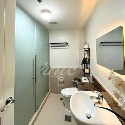 a bathroom with a toilet and a sink at A Space Close to Transits or Airport in Manila