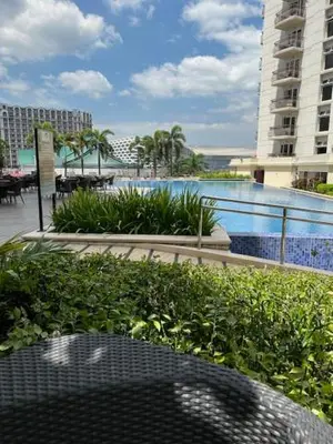 a view of a balcony with a table and a pool at Solemare Parksuites - no balcony in Manila