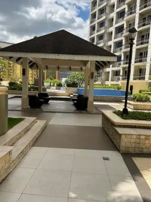 a gazebo in the middle of a building at Solemare Parksuites - no balcony in Manila