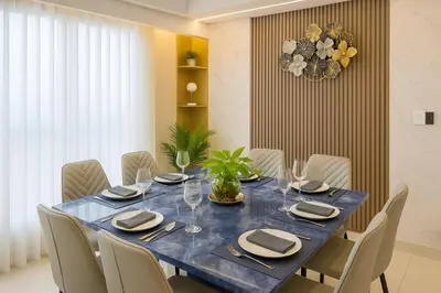a dining room with a blue table and chairs at Spacious 5-Bedroom Luxury Apartment Across Okada in Manila