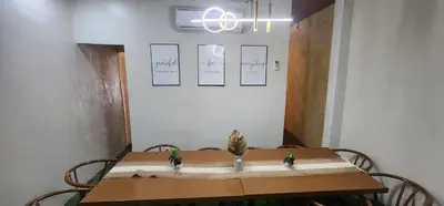 a table with two birds sitting on top of it at Cozy Villa with Pool for family or couples in Bacoor