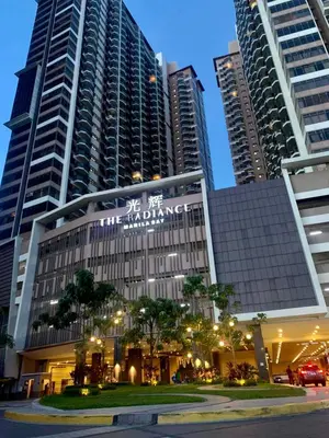 a building in a city with tall buildings at Manila Bay Condo in Manila