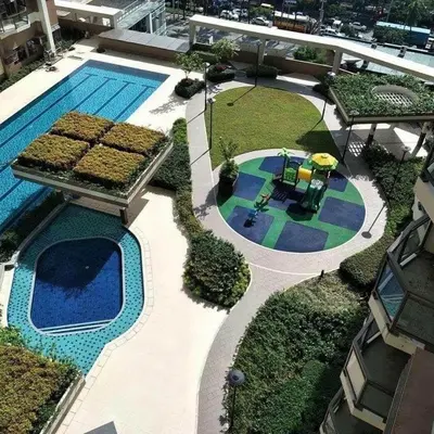 an overhead view of a swimming pool with a playground at Manila Bay Condo in Manila