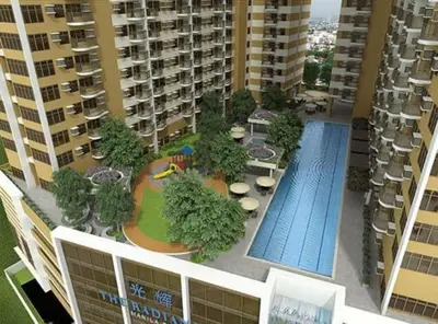 an aerial view of a apartment complex with a swimming pool at Manila Bay Condo in Manila