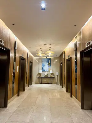 a hallway in a building with a painting on the wall at Soléa Suites in Manila
