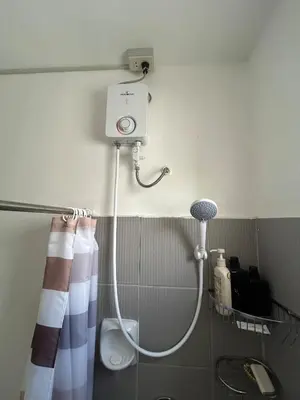 a shower in a bathroom with a shower at Norene Bianca Staycation in Carmona