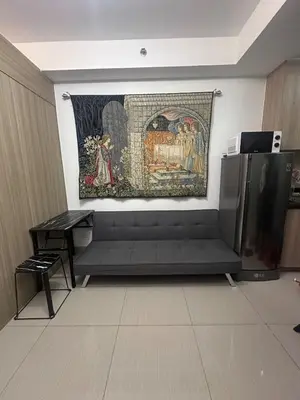 a tapestry hanging on a wall in a room at Shore 2 tower 1 by Richnells cozy Oasis in Manila