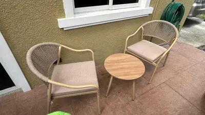 a couple of chairs and a table and a window at The Grand Escape - Suntrust Verona, Silang Cavite in Silang