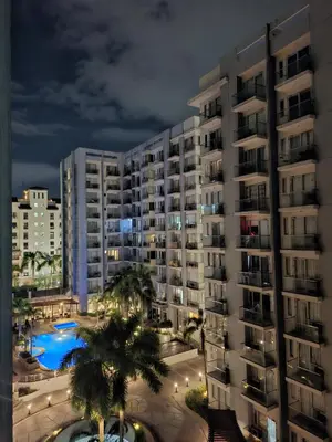 a view of a large apartment building at night at Kmad's Condotel in Manila