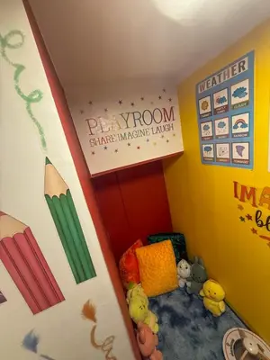 a small room with stuffed animals and a surfboard at Twins Nest - CASA VICENTE Cozy 2-Bedroom Loft Condo Mandaluyong in Manila