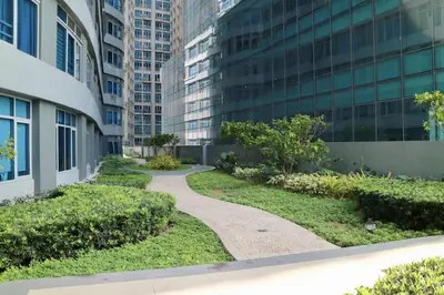 a walkway in front of a tall building at Eastwood Legrand3 Studio Type condo in Manila
