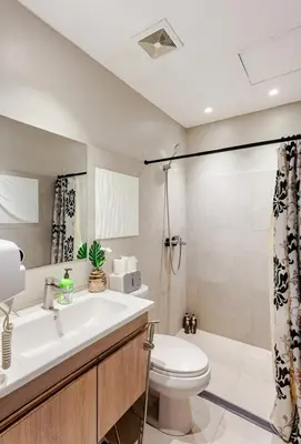 a bathroom with a sink and a toilet at Amazing 1 5BR unit Connected to Eastwood Mall in Manila