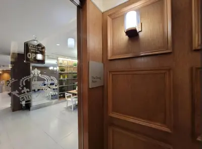 a door in a store with a sign on it at Incredible Makati Studio Unit w Stunning view & 65 TV in Manila