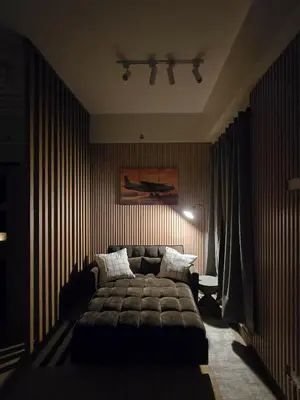 a bedroom with a bed and a couch at The Beacon Haven in Trece Martires