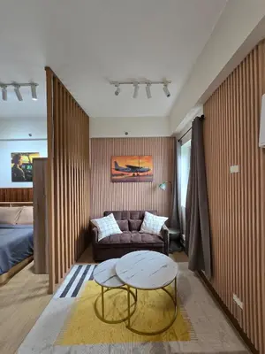 a living room with a couch and a table at The Beacon Haven in Trece Martires