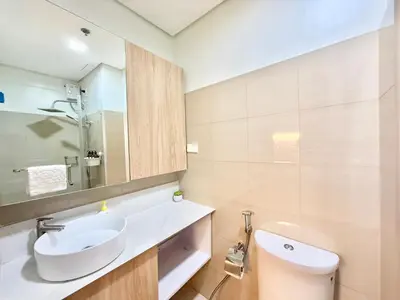 a bathroom with a sink and a toilet at ClaySky Staycation at Shore 2 Residences Tower 2 near Mall of Asia- Hotel Set Up in Amenity and Pool Level with Netflix, HBO Max & Youtube Premium in Manila