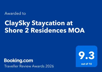 a blue sign with the words slayley vacation at shore moa at ClaySky Staycation at Shore 2 Residences Tower 2 near Mall of Asia- Hotel Set Up in Amenity and Pool Level with Netflix, HBO Max & Youtube Premium in Manila