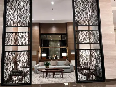 a living room with a couch and a table at Radiance Manila Bay Bayview Comfort with Pool & Pet-Friendly in Manila