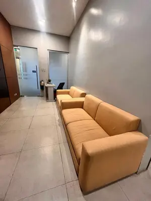 a waiting room with brown leather couches at Radiance Manila Bay Bayview Comfort with Pool & Pet-Friendly in Manila