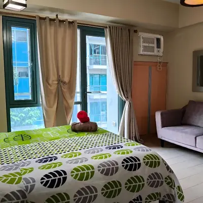 a bedroom with a bed with a teddy bear on it at LDN Secret Crib 3P - Two Palm in Manila