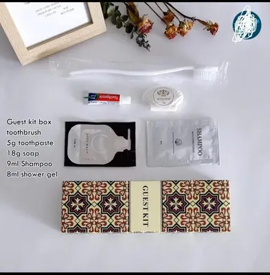 a box of sunscreen and a book on a table at Elegant Golden Loft with Mood Lighting Central Location and Skyline Views in Manila
