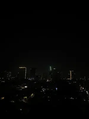 a nighttime view of a city at night at Elegant Golden Loft with Mood Lighting Central Location and Skyline Views in Manila