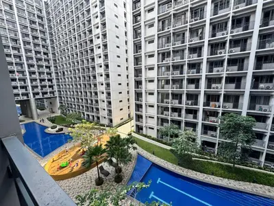 an overhead view of a large apartment building with a swimming pool at 1645 Coffee Room Shore 2 Residences Pool View by Prime Stay MOA in Manila
