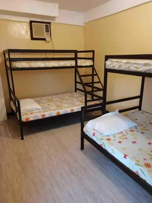 a room with two bunk beds and a fan at Casa Ylaya - a New Private Pool Getaway in General Trias