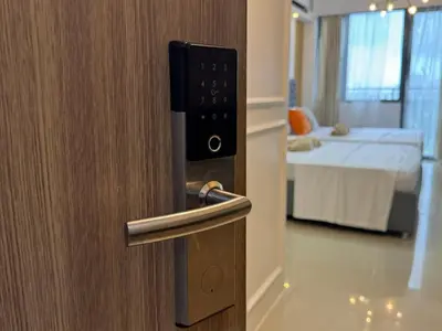 a door to a room with a room with a bed at Shore 2 Residences RM 19106 Pool View by Prime Stay MOA in Manila