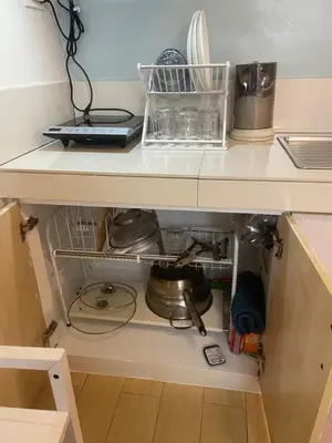 a kitchen drawer with dishes and utensils at Cozy Oasis Free pool, netflix, playground in Manila