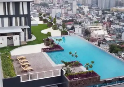 a large swimming pool on top of a building at The Camden Place 1BR Condo Apartment in Manila