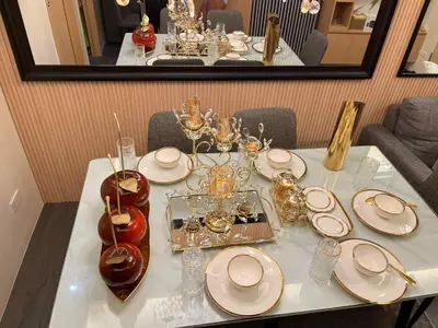a table with plates and glasses on top of it at Palacio Inglaterra in Manila