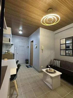 a living room with a couch and a table at Stay at FB Harrison near World Trade Center MOA and NAIA in Manila