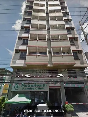 a tall building with a store in front of it at Stay at FB Harrison near World Trade Center MOA and NAIA in Manila