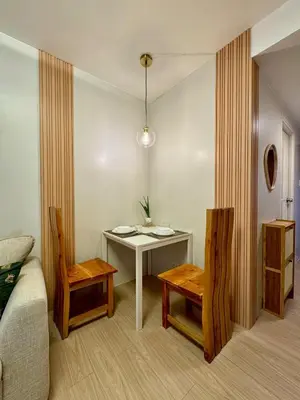 a room with a table and two chairs and a couch at A and A Place - The Hive C - Free Parking in Taytay