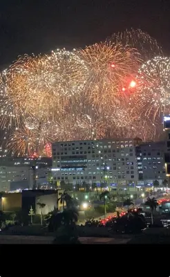 a fireworks display over a city at night at Shore 1 Residences Tower D Pasay in Manila