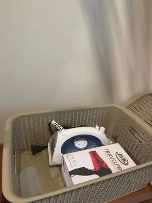a basket with a book and a tea kettle at Erin Serenity Harbor in Manila