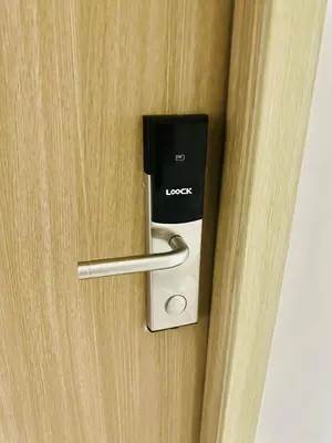 a hotel door with a lock on it at Shore Bliss Staycation MOA in Manila