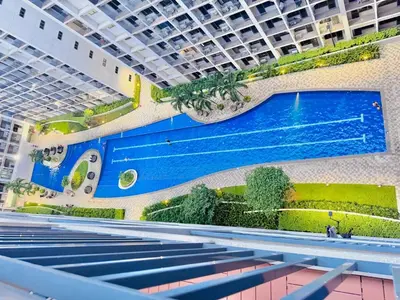 an overhead view of a swimming pool in a building at 1 Bedroom Apartment in Pasay near MOA in Manila