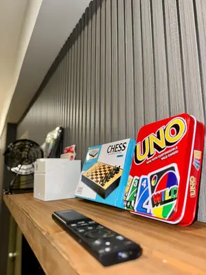 a desk with a box of oreos and a box of snacks at GreyKey Stays at the 34th in Manila