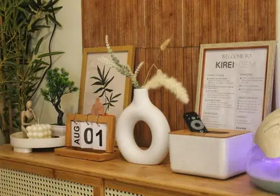 a shelf with a vase and other items on it at Japandi - Inspired Staycation MOA Pasay City in Manila
