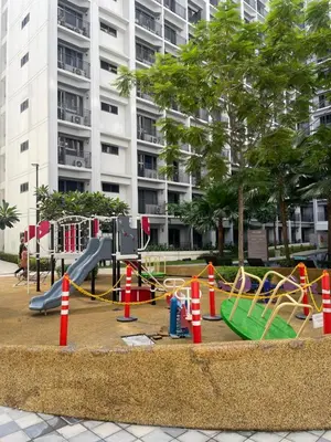 a park with a playground with a slide at Japandi - Inspired Staycation MOA Pasay City in Manila