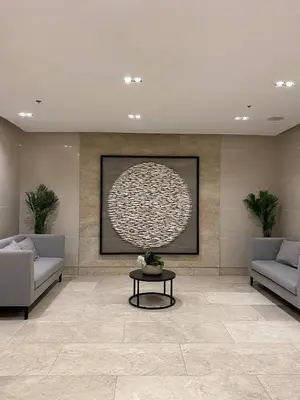 a living room with two couches and a table at Cabin and a cozy stay near MOA in Manila