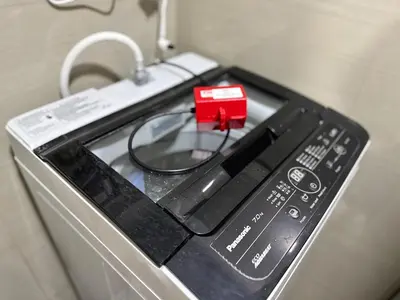 a remote control sitting on top of a stove at Room 1469 Shore 2 Residences Near Airport, MOA by Prime Stay MOA in Manila